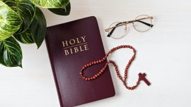 Holy Bible on white wooden table. Christian devotion, Easter celebration